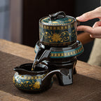 Decorative teapot with intricate designs being used on a wooden surface.